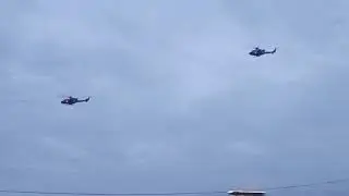 Two Bell Military Helicopters After Take-Off