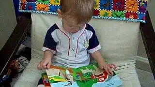 TJ reading his farm animal book