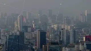 Aerial view of the city of Lima, Peru, with high rise buildings and skyscrapers enveloped in a thick