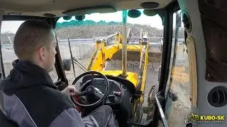 JCB 4CX ECO pushing gravel - backhoe cab view