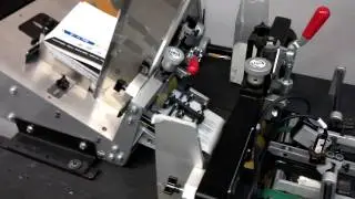 Kirk Rudy addressing tabbing system w/12' conveyor