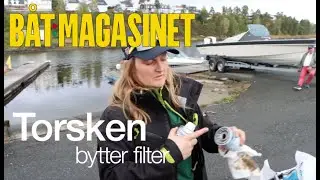 Torsken skifter filtere p&aring; firetakt utenbordsmotor