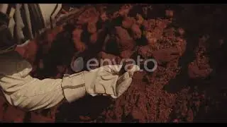 Astronaut Examining Rock on Mars | Stock Footage - Envato elements