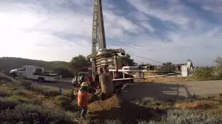 Ezbore Bucket Drill Rig dumping the drilling bucket