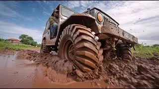 man driving a big tyre jeep in 3