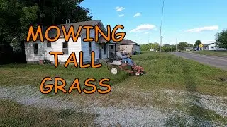 Exmark Lazer Z Mowing Overgrown Lawn