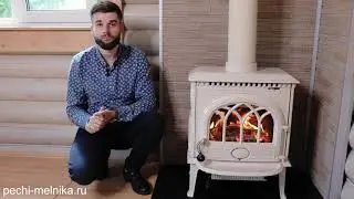 печь Jotul в доме из бревна