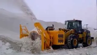 Larue D87 single-stage snow blower operating at snow dump site