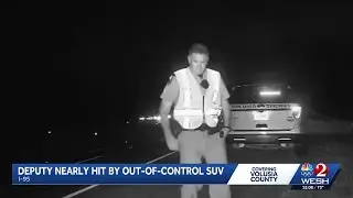Dashcam video shows Florida state trooper, deputy nearly hit by out-of-control SUV in I-95