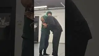Guillotine choke defense 2. Put hand in.