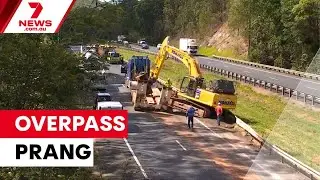 Truck crashes into Bruce Highway overpass | 7NEWS