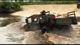 Hummer drives into deep pond and sinks it completely