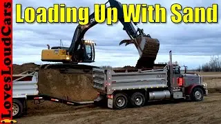 John Deere 290C Excavator loading sand