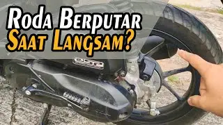 The rear wheel of an automatic motorbike spins when idling.