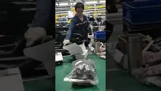 Auto parts factory workers assemble auto parts like this