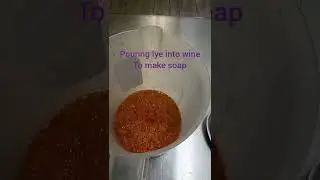 Wine soap in the making, adding lye to the wine.