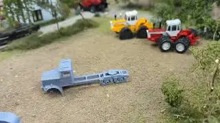My finds from the Richmond Indiana Farm Toy Show . Customs, kits, parts, and a show tractor