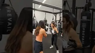 Andrea teaches ExtraEmily how to box