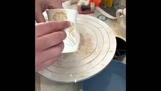 Applying gold over glaze and mother of pearl on pottery