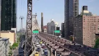 establishing shot of street traffic cars and urban city landmarks scenery