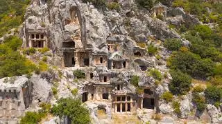 Demre, Turkey. Close up aerial view of Lycian rock-cut tombs showing erosion patterns and stone t...