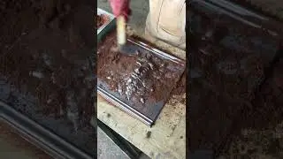 Sand casting a Green Man in solid lead