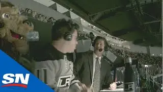 Los Angeles Kings' Mascot Bailey Scares Unknowing Fan In Broadcast Booth