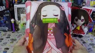 Aliexpress Demon Slayer Nezuko Kamado reversible pillow and hand warmer.