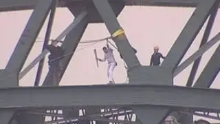 Bear Grylls zipwires from Tyne Bridge with Olympic Torch