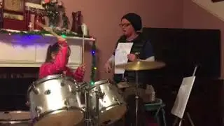Jyn teaching Raelin a drum portion of Crazy Train!