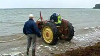 Tractor drives underwater in Denmark at Sønderborg.