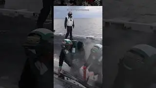 Sailors Grease the Catapult Shuttle Before Launching Aircraft