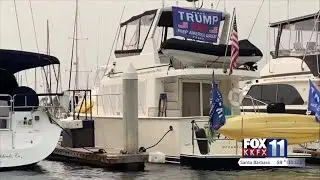 Political flags fly on local boats and docks