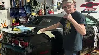 Applying the Butter Wax to the passage rear quarter panel 