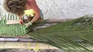 Weaving a palm frond by hand