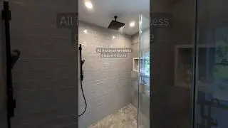 A rainfall shower head, built-in niche, and frameless glass enclosure for a dreamy spa-like shower!