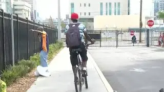 Volunteers build bikes for homeless