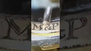 Hand engraving 2mm letters inside of a gold