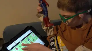 10 Year Old Learning New Words On His Talking Device