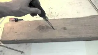 A demonstration of how the slot head screw driver should be used