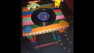 Upcycling a cheap thrift store table. A pop art record style coffee table design.