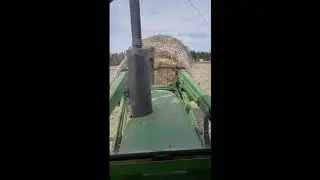 Hauling Canola Straw and Hooking up to Harrows