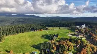 beautiful rural landscape showcasing animals peacefully grazing across lush and expansive fields