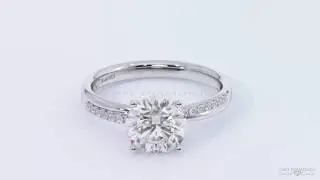 Unique cross over side stone  four claw twist engagement ring platinum white gold