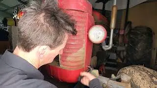 Taking the grill off a 1958 Massey Ferguson 65