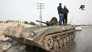 Abandoned tanks, displaced people return home after rebels captured Syria's Hama