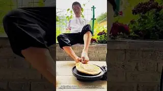 The process of a man without arms making pancakes