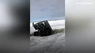 Badly parked  car sinks in the ice