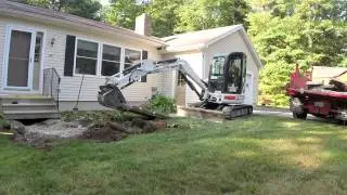Mini Excavator Demolishing Concrete Walkway