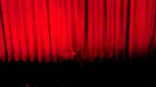 Billie Joe being awesome behind red curtain